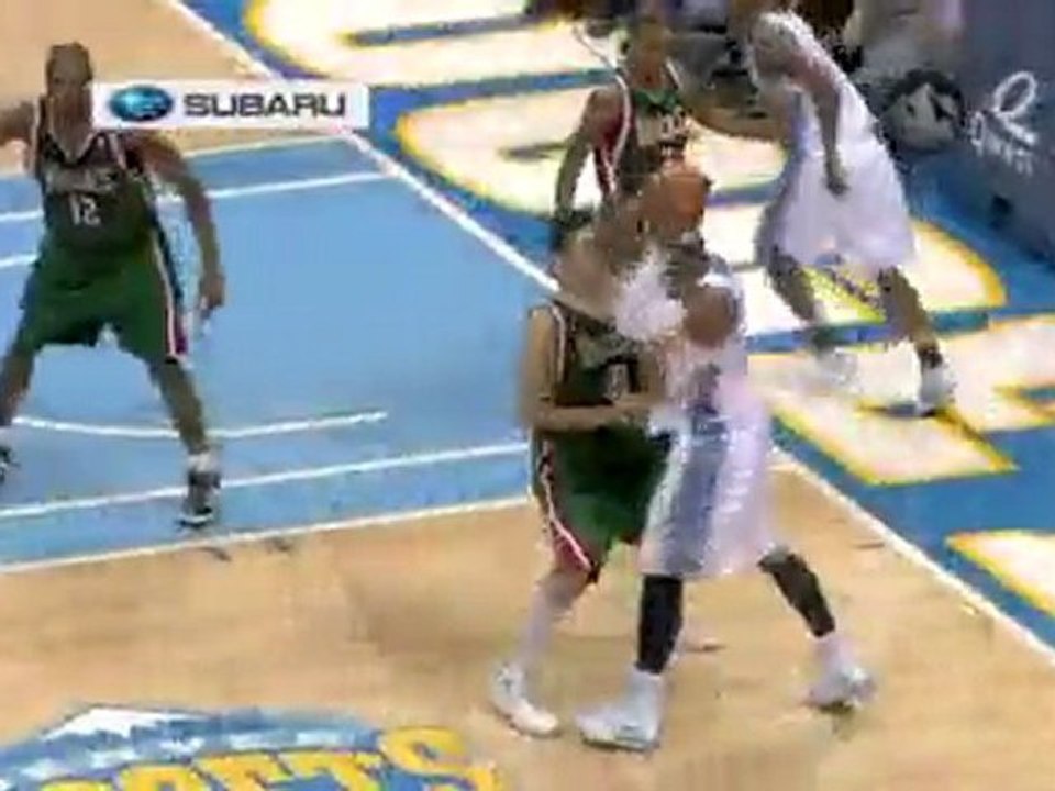 Johan Petro follows up Carmelo Anthony's missed layup with a