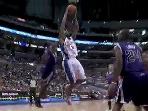 Travis Outlaw drives past Donte Greene and finishes with a t