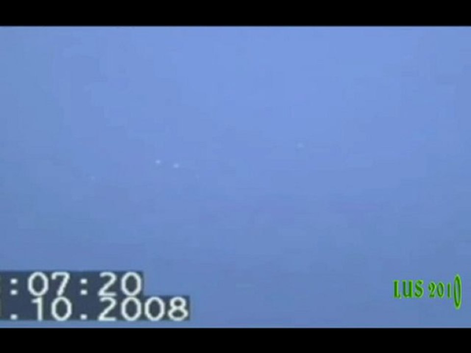Multiple daytime UFO Orbs near plane -Italy 19 October 2008