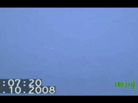 Multiple daytime UFO Orbs near plane -Italy 19 October 2008