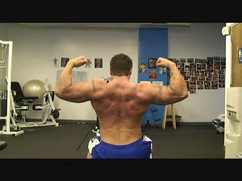 Shoulder Press with Flexing- Fitness Model Micah LaCerte