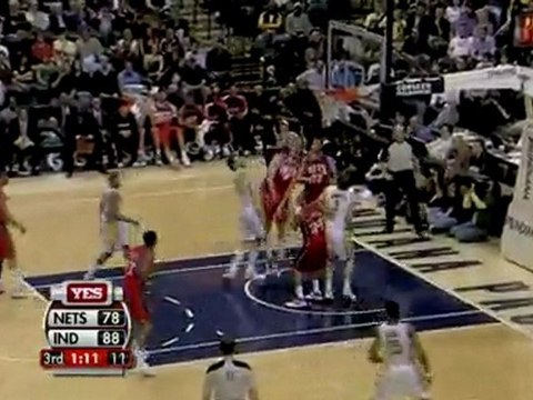 Josh Boone rises up to swat Josh McRoberts' shot away.