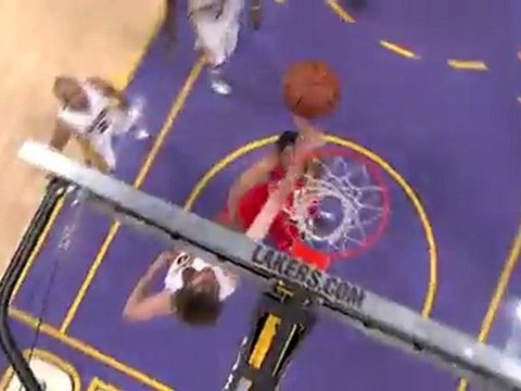Andre Miller gets the tough shot over Pau Gasol to fall.