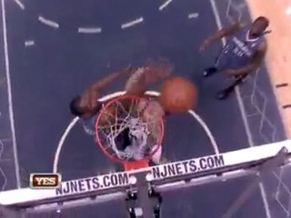 Theo Ratliff protects the basket with the block.