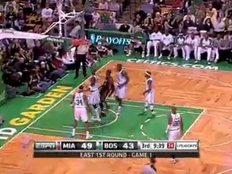 Dwyane Wade puts back the miss with a two-handed dunk.