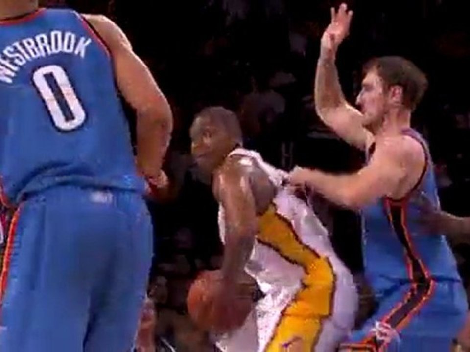 Andrew Bynum backs in and then turns to throw don the one-ha