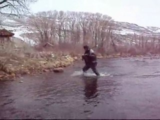Trout fisherman falls in the water