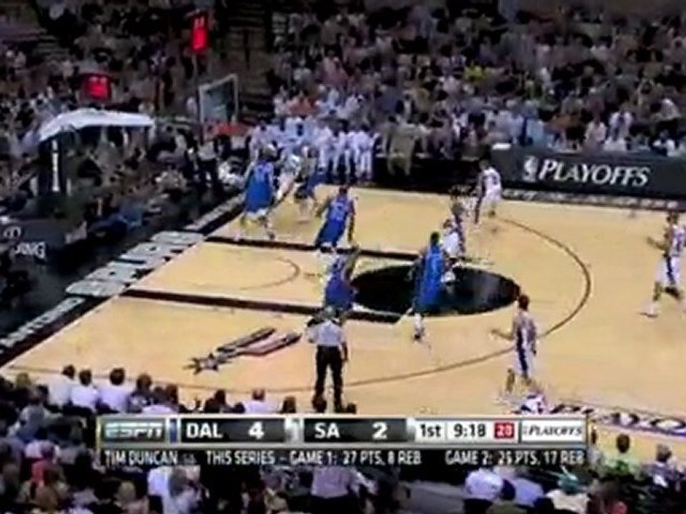 Tim Duncan blocks Erick Dampier's shot.  Richard Jefferson t
