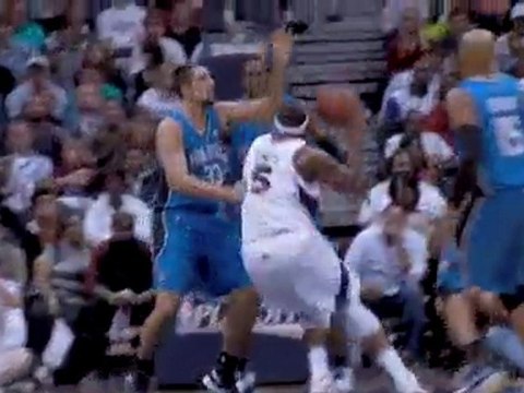 Dwight Howard blocks the Josh Smith shot attempt in the lane