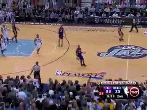 Andrew Bynum swats the shot out of bounds.