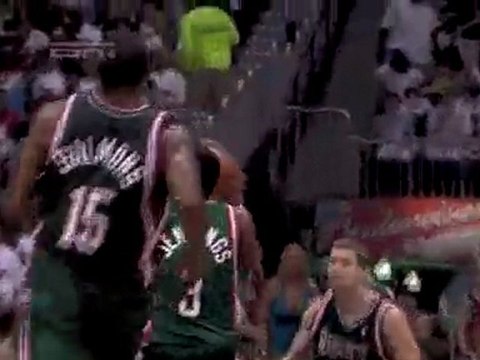 Brandon Jennings takes the ball around his back for the layu