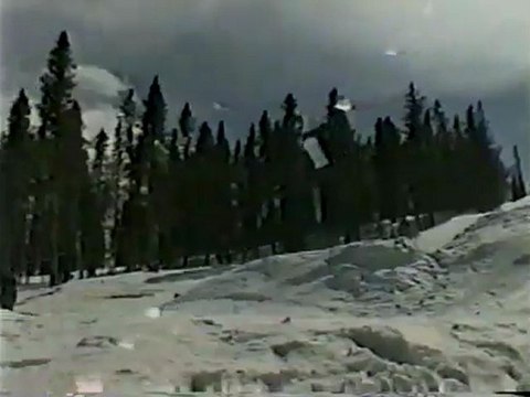 snowboarder comes up short and crashes on a big icy gap ...