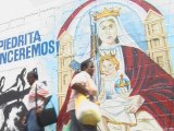 Graffiti homages to Chávez cover the walls of Caracas