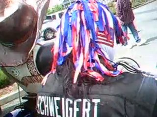 masked man & bear on motorcycles.