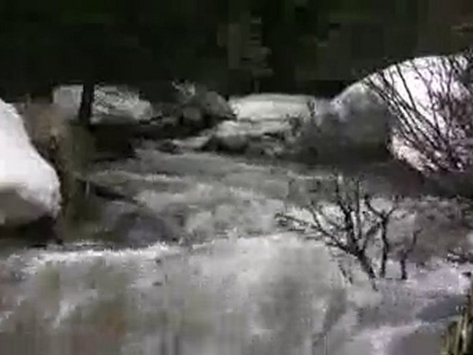 Snowmelt Creek Overflowing Banks