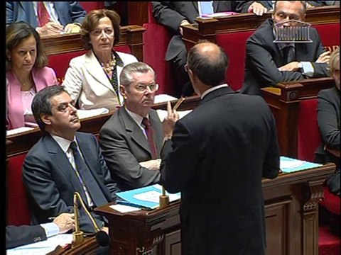 Sarkozy sacrifices ministers to save key ally