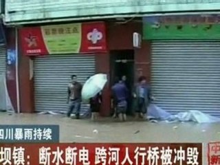 Chinese authorites try to stop dam flooding