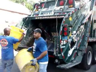 Loading a garbage truck and crushing house contents