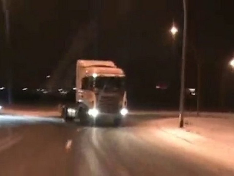 Huge Semi Drifts On Icy Road