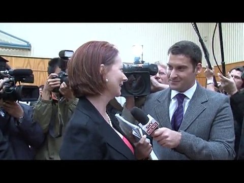 Australian PM votes in photo-finish election