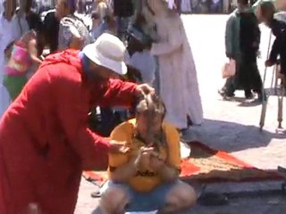 Marrakesh cheeky Berber puts snake round my neck as I film Howie and snakeman