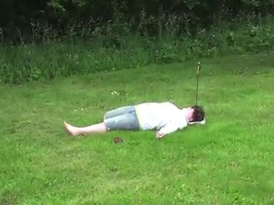 Shooting an apple off a kid's head - Archery