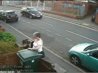 Woman caught dumping cat in wheelie bin on CCTV