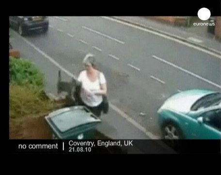UK: Woman caught dumping cat in bin - no comment