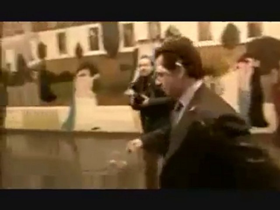 Nicolas Sarkozy, French president, being attacked by a pie