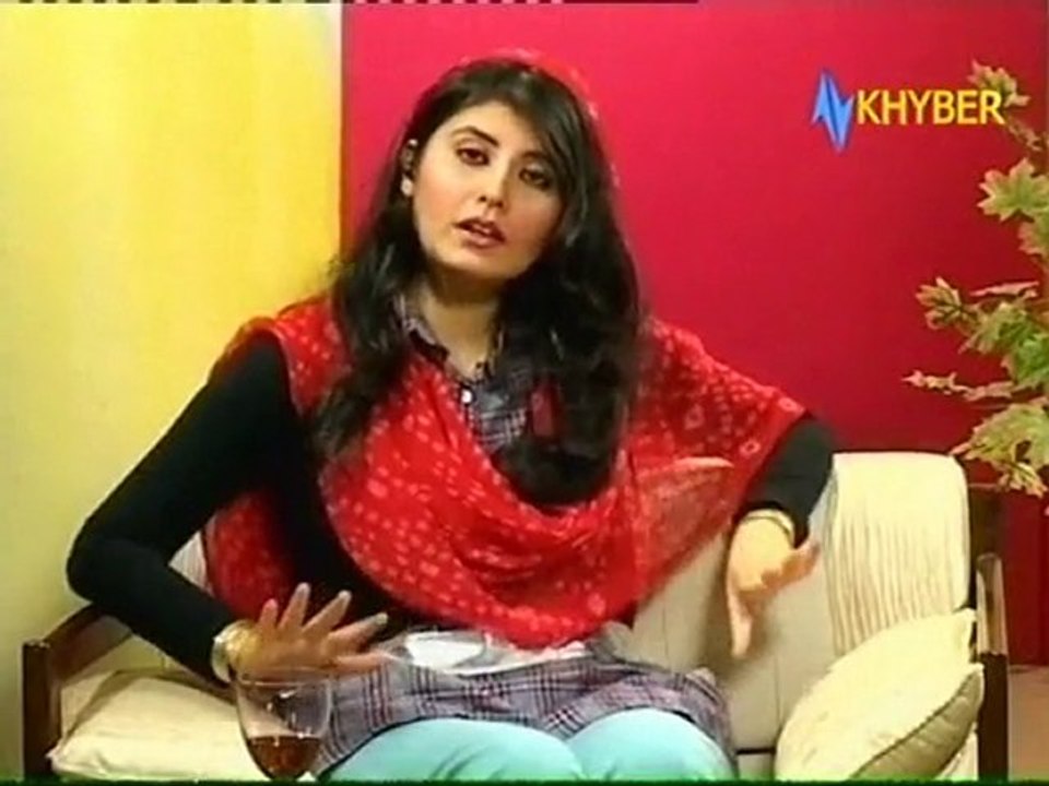 Najiba Faiz, Tomato Red On Black Sweater