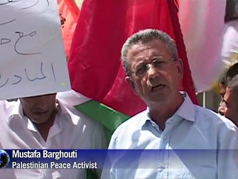 Palestinians protest as Israeli settlers begin building