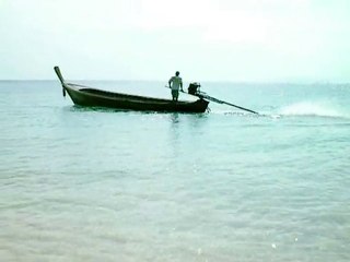 long tail boat on ko bulon beach    Thailand