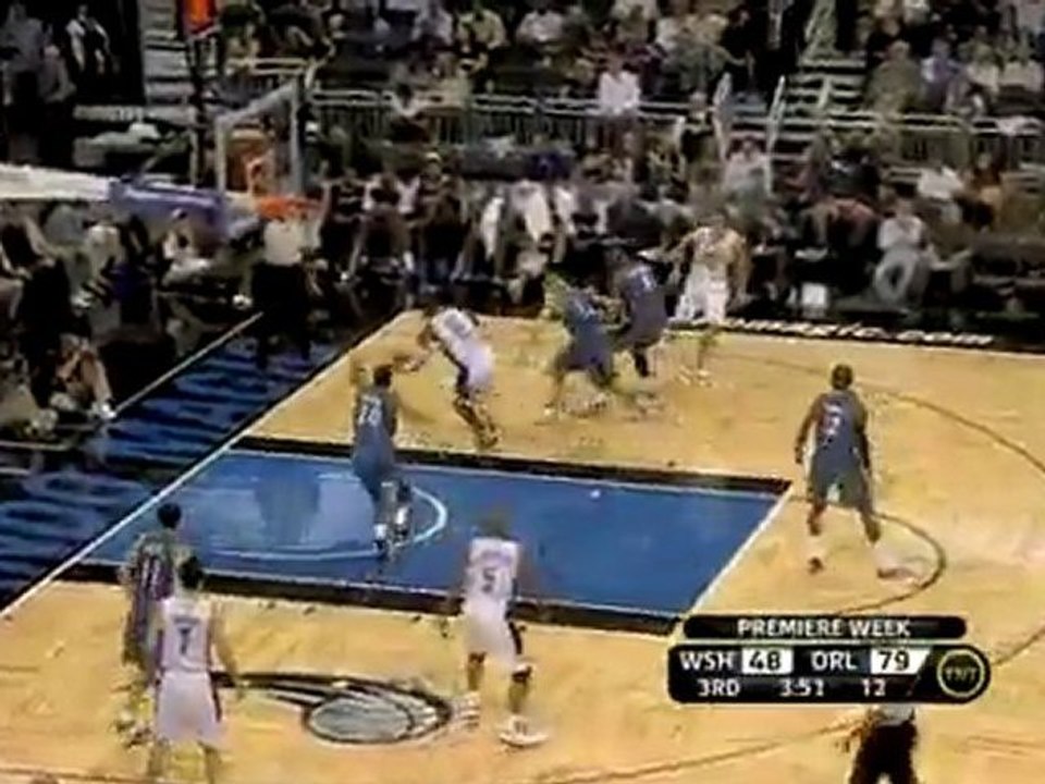 Cartier Martin rises up to block Dwight Howard.