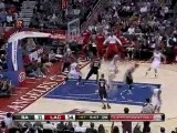 Eric Gordon drives down the lane and goes over Tim Duncan fo
