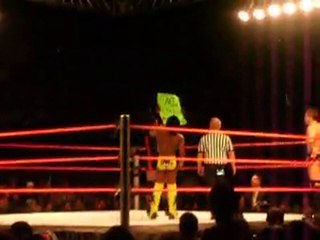 WWE wrestler MVP shows a fans sign