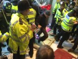 Student protesters smash way into British PM's party HQ