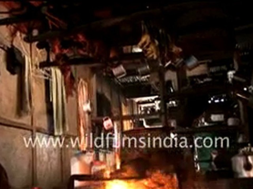 Apatani women cooking pig