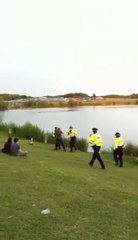 Cop Gets pushed in lake