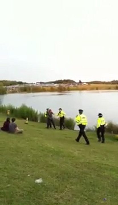 Cop Gets pushed in lake