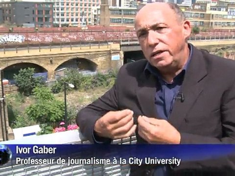 Arabic-Web-Murdoch apologises to victims as aide Brooks quits