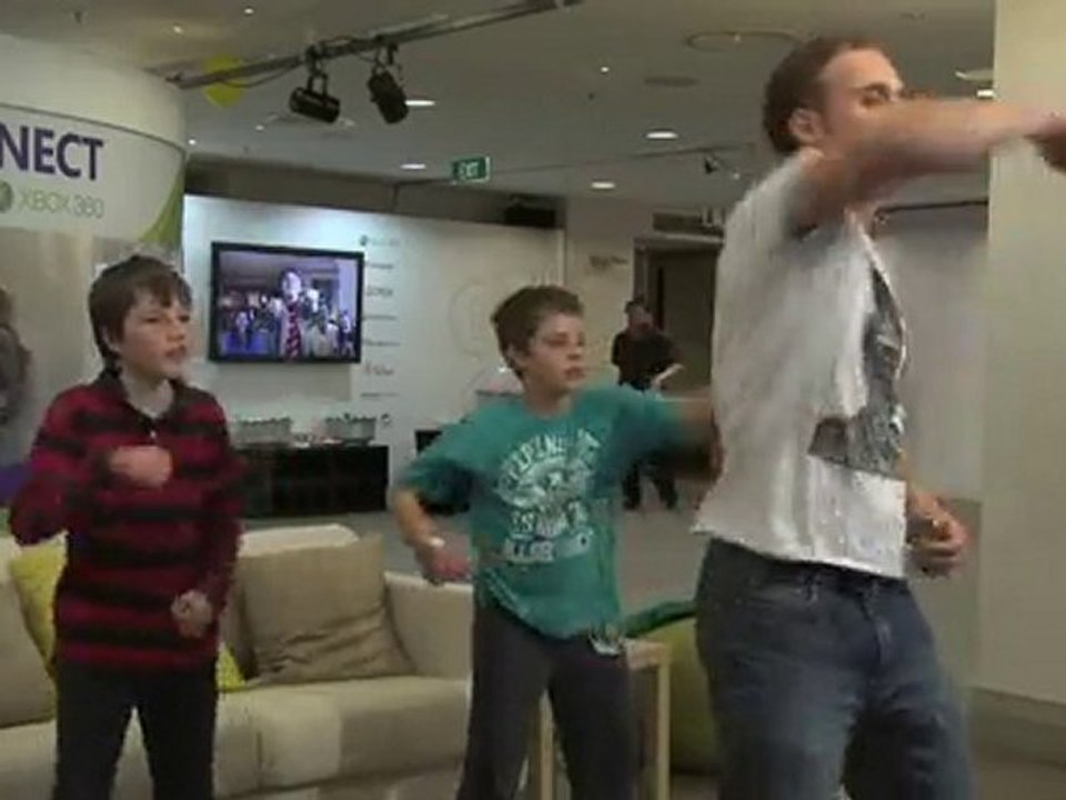 Guy and two kids playing Dance Central for Xbox Kinect