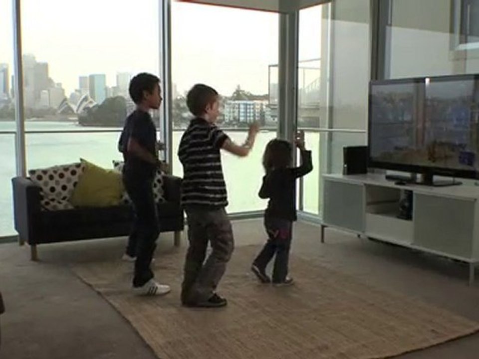 Three kids playing Dance Central for Xbox Kinect