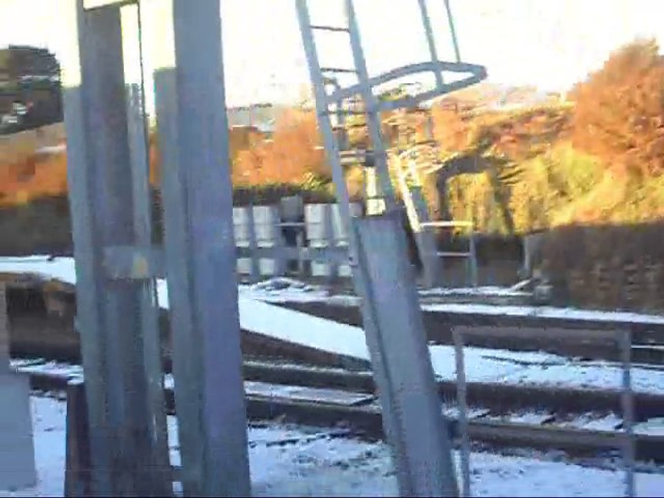 South west train depparting bournemouth in the snow