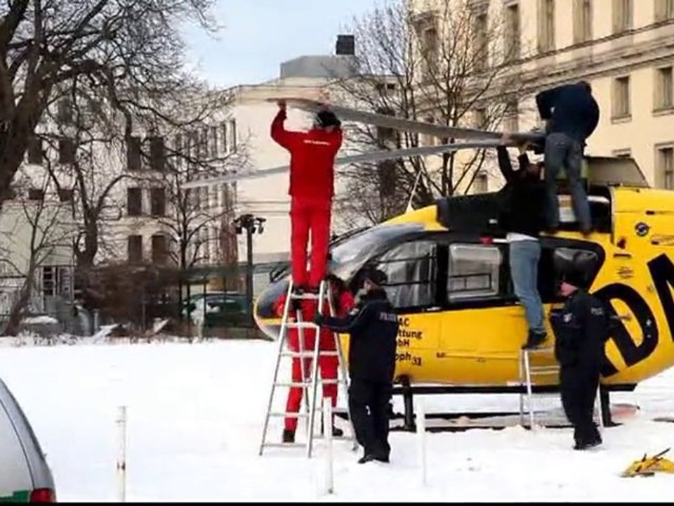 Rescue helicopter pushes against barrier