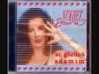 NÜKHET DURU AÇ GÖZÜNÜ ADAMIM