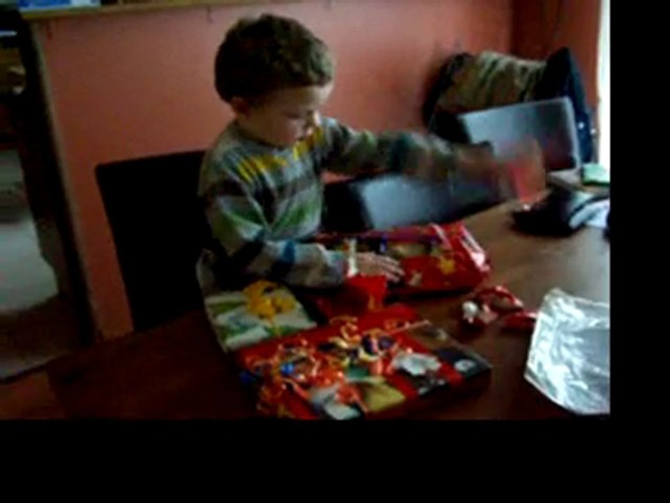 Benjamin opening Christmas presents 1
