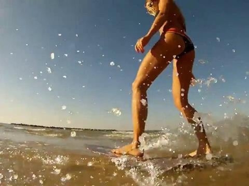 Skimboard : Beautiful girl skimboarding for fun
