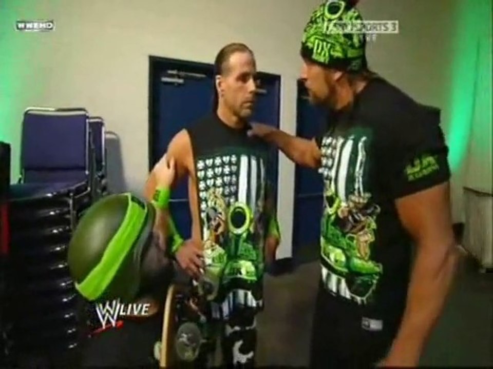 Triple H ties Hornswoggle to a skateboard