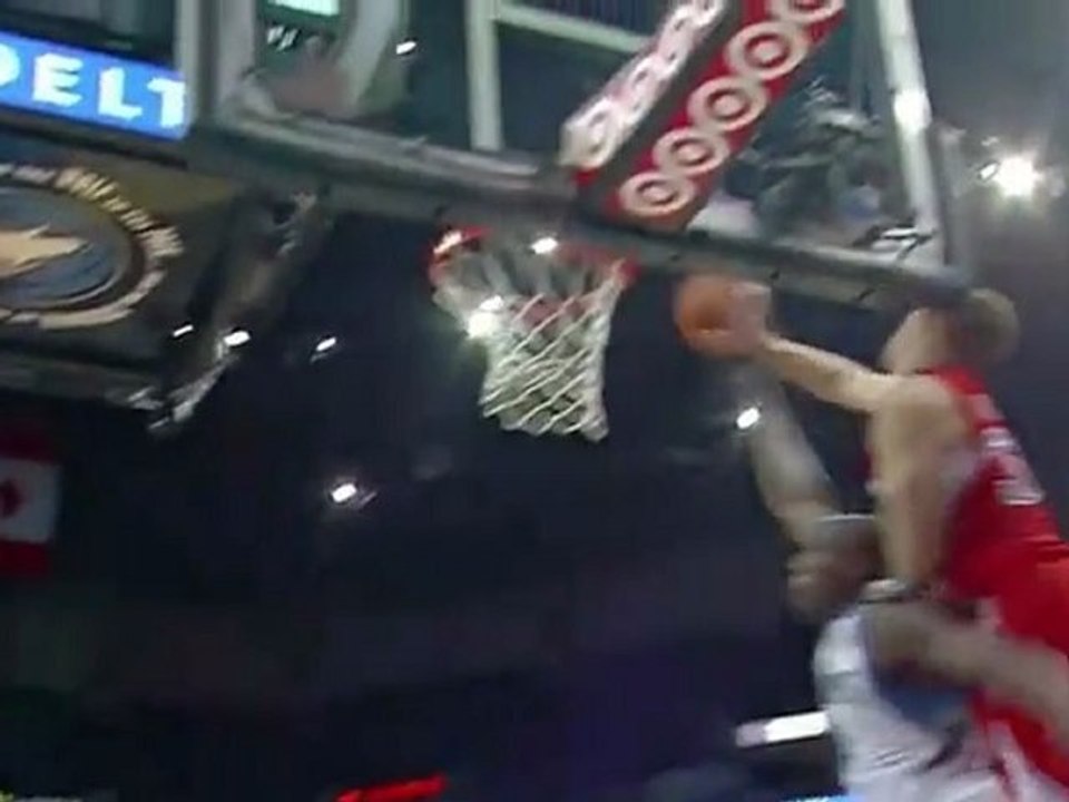 Blake Griffin bangs his head on the backboard