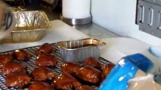 Scottie Johnson works with chicken thighs at BBQ